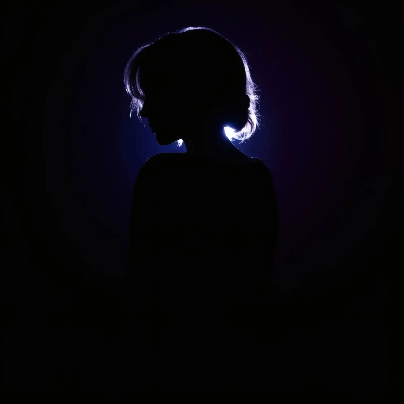 Silhouette of a child against a dark background illuminated canvas by DesignDoodle
