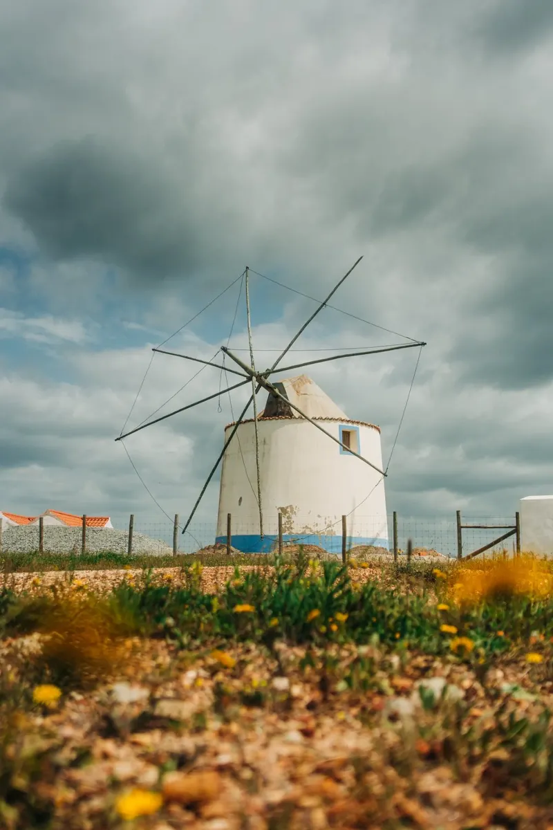 Old windmill in Portugal - Landscape photo in the Algarve canvas with Floater frame by Bold and Retro