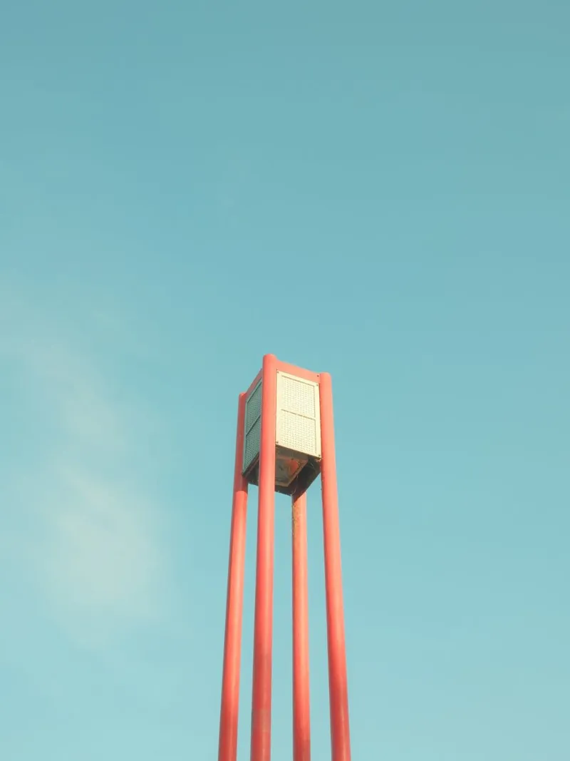 Urban Lamp Under Blue Skies poster with wooden frame by FujiPrints