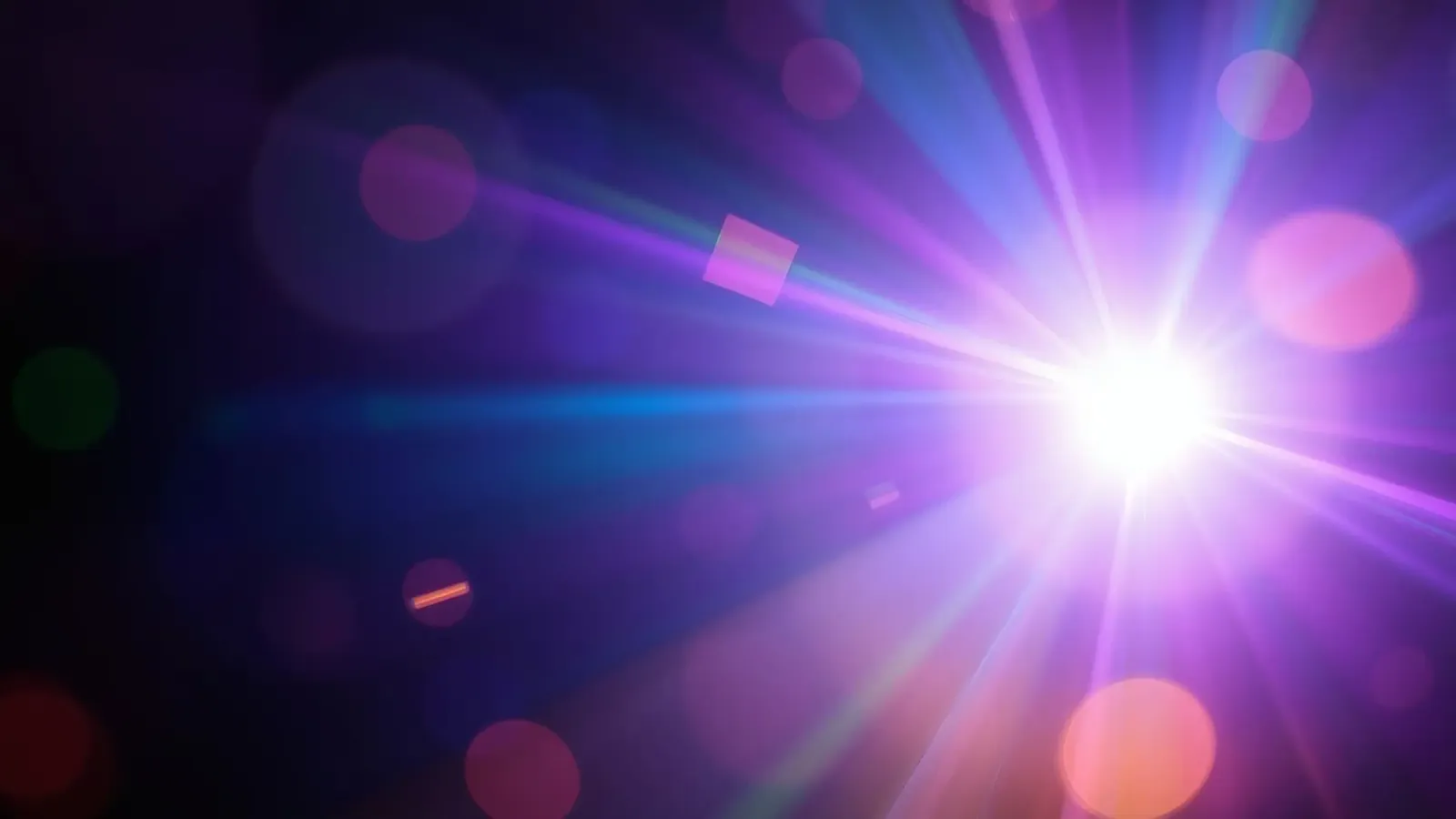 Colorful light rays create a vibrant display in a dark art canvas by DesignDoodle