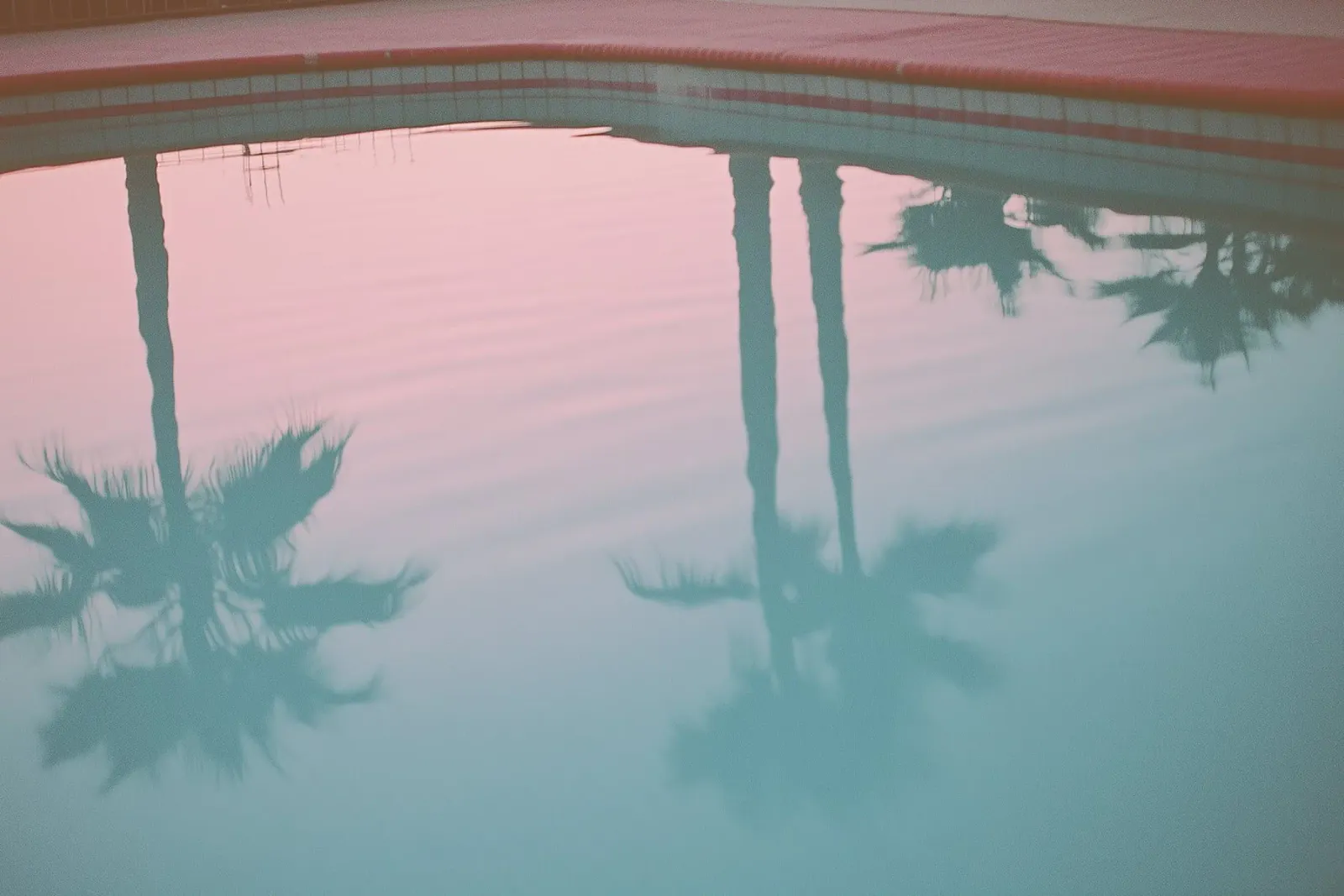 USA SérIA I Reflections of palm trees at the pool and a pink sky canvas by Julie Travel Photography