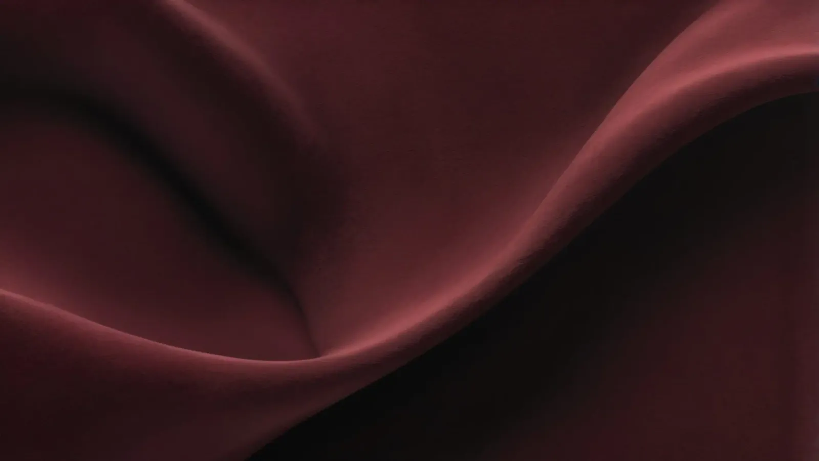 Elegant abstract background featuring smooth, flowing maroon canvas by DesignDoodle