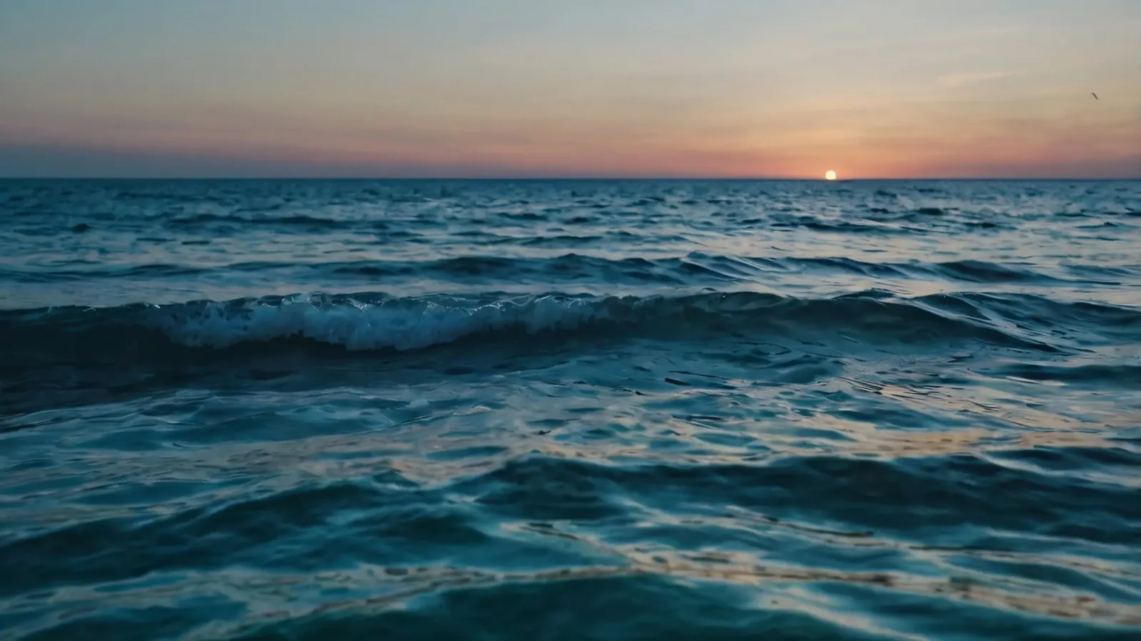 Beautiful sunset over the ocean with gentle waves reflecting canvas with Floater frame by DesignDoodle
