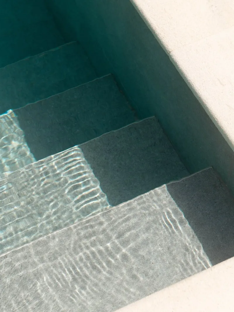 Minimalistic pool steps with turquoise water canvas by Kimberley Jekel Photography