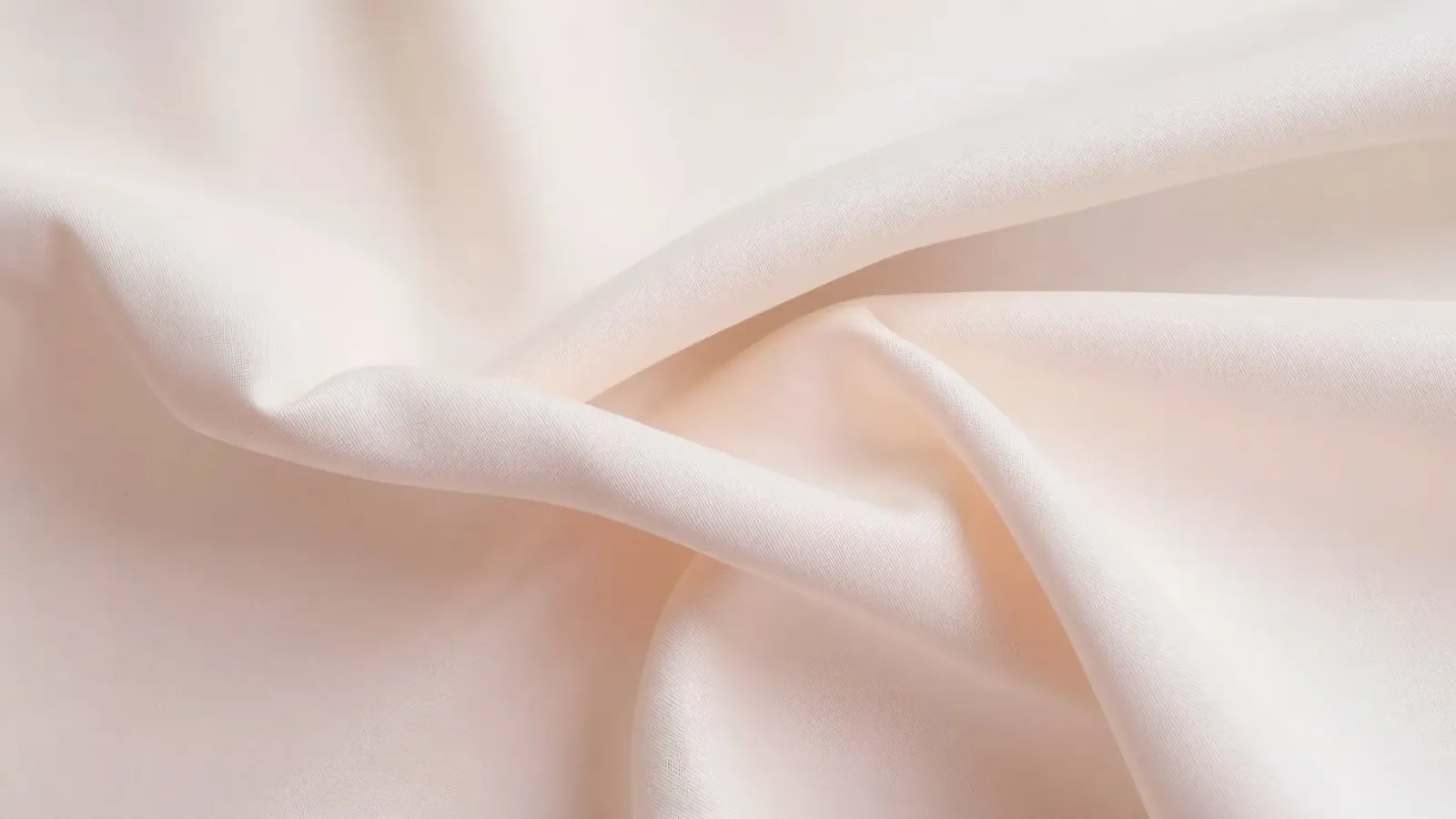 Soft beige fabric draped and folded on a surface hahnemühle by DesignDoodle