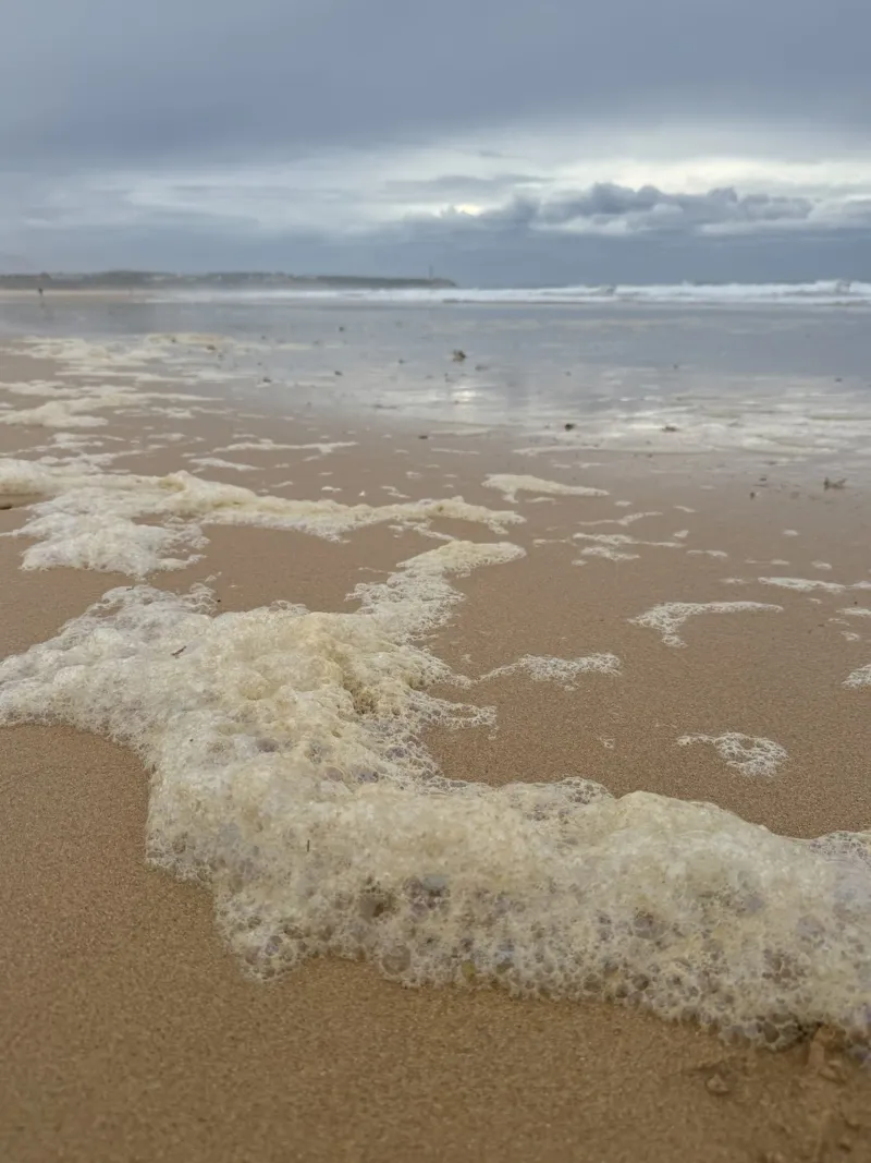 Foam Bubbles under a Cloudy sky at the Beach hahnemühle by byrieneke