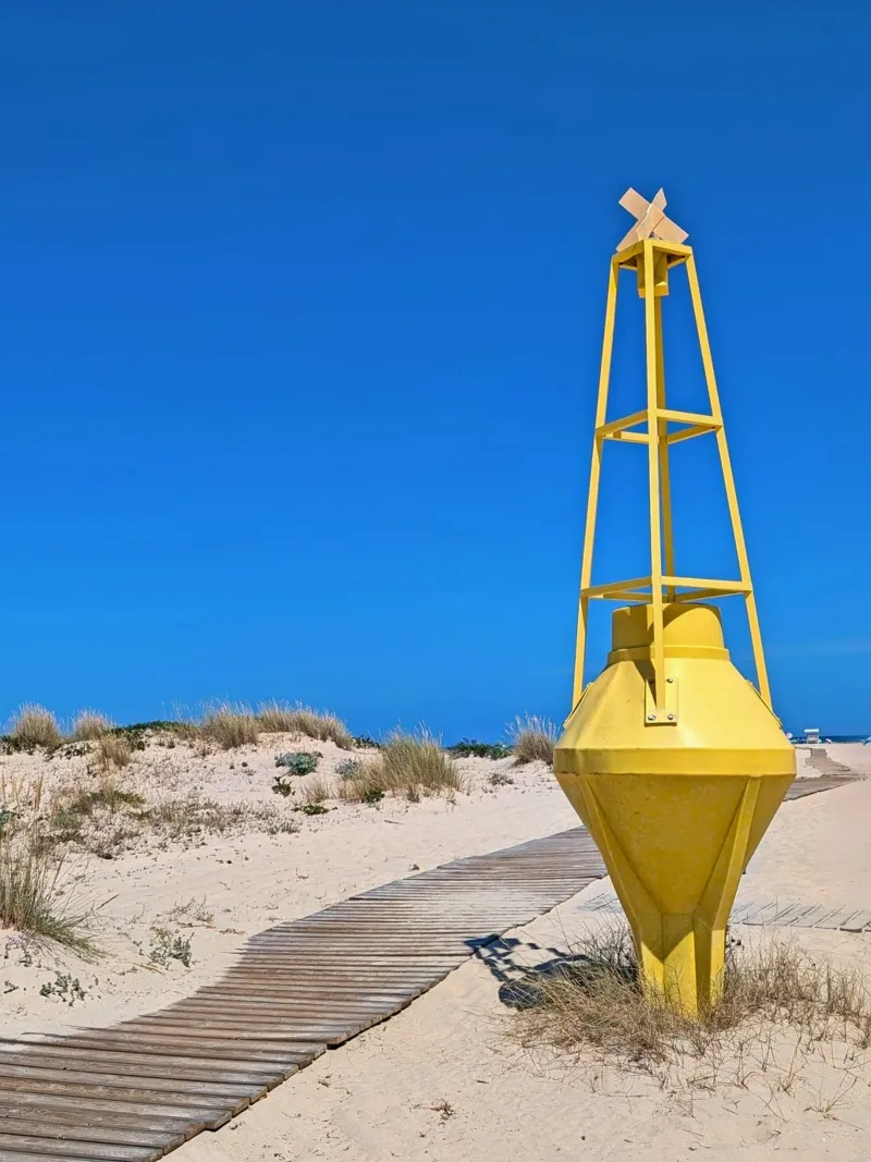 Faro giallo sull'isola di Armona, Algarve, Portogallo poster da Hecate Pim Designs