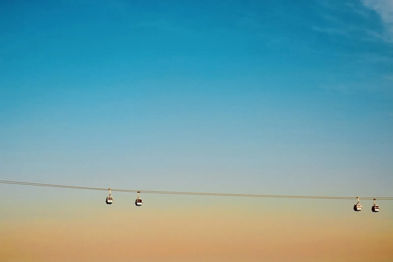 Cable Cars in Orange Sunset acrylic glass by KISSA STUDIO