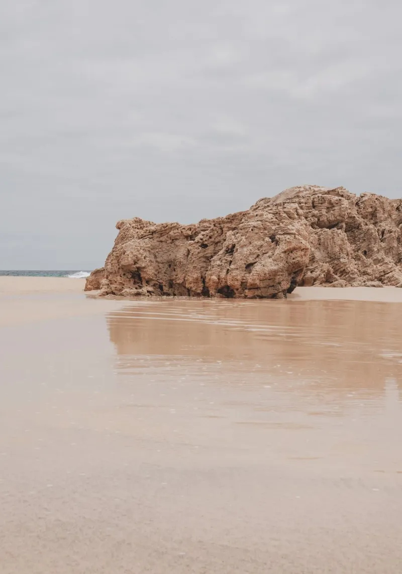 Deserted Beach with Cliff - Minimalist Coastal Art canvas with Floater frame by ClubArt