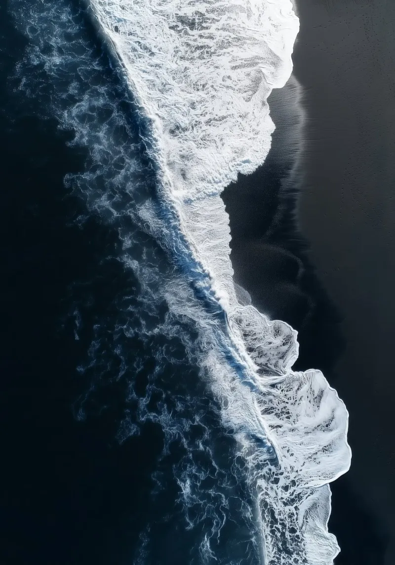Black Sand Beach & Ocean Waves - Aerial Coastal Poster Hahnemühle von Vela Luna