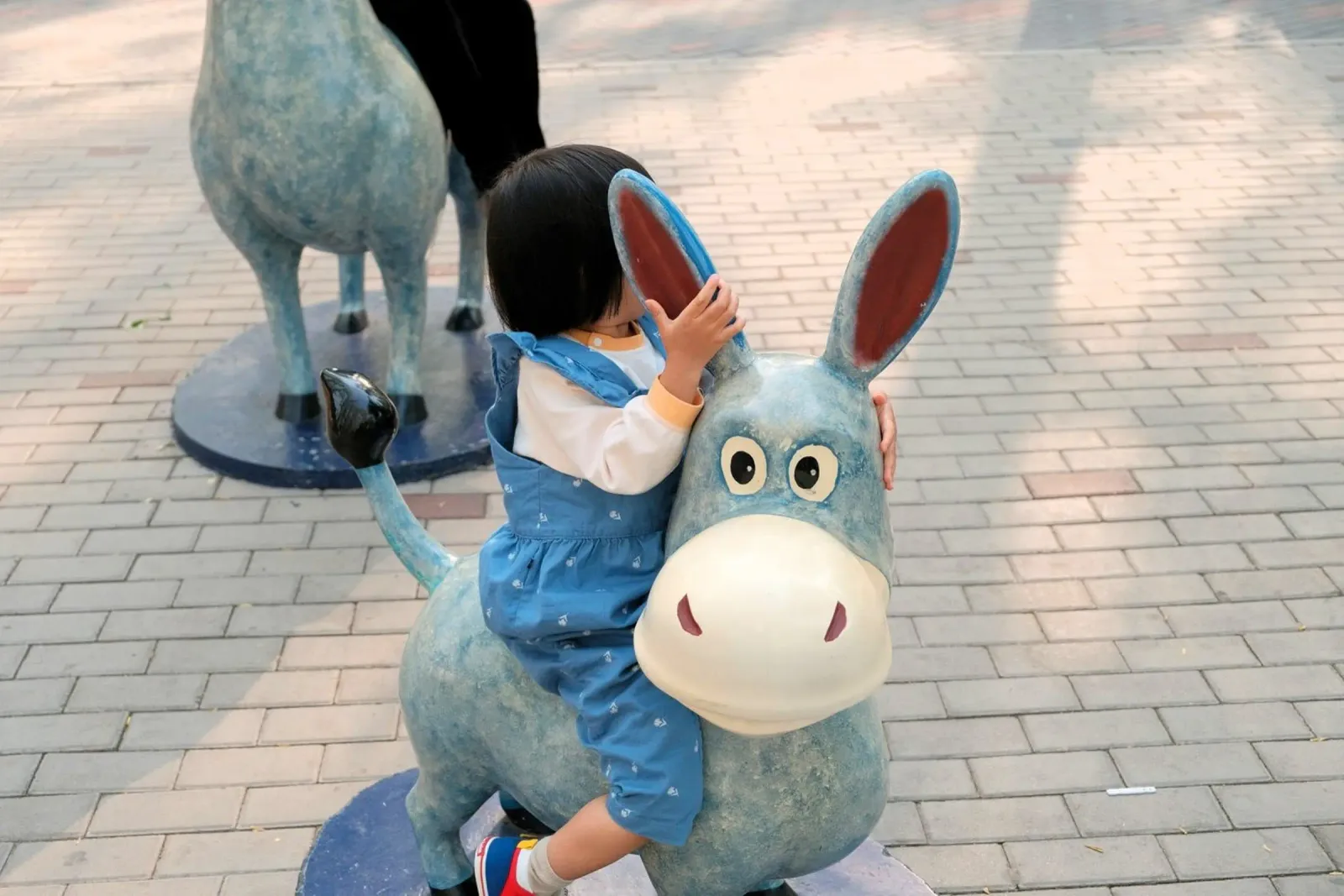child riding blue donkey poster with aluminum frame by animal story home