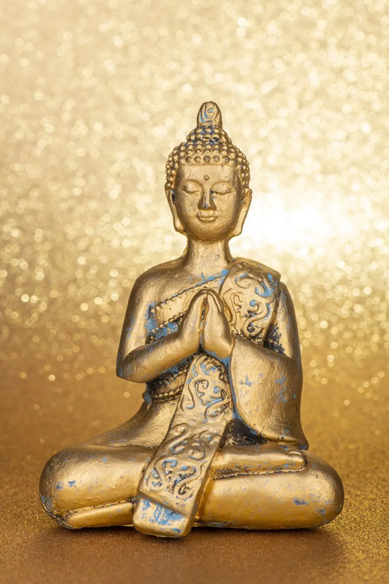 Golden Buddha in front of a shiny background canvas by Bilderwelt - Kunst für die Wand