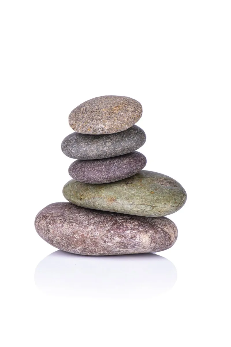 Stone stack in balance against a white background canvas by Bilderwelt - Kunst für die Wand