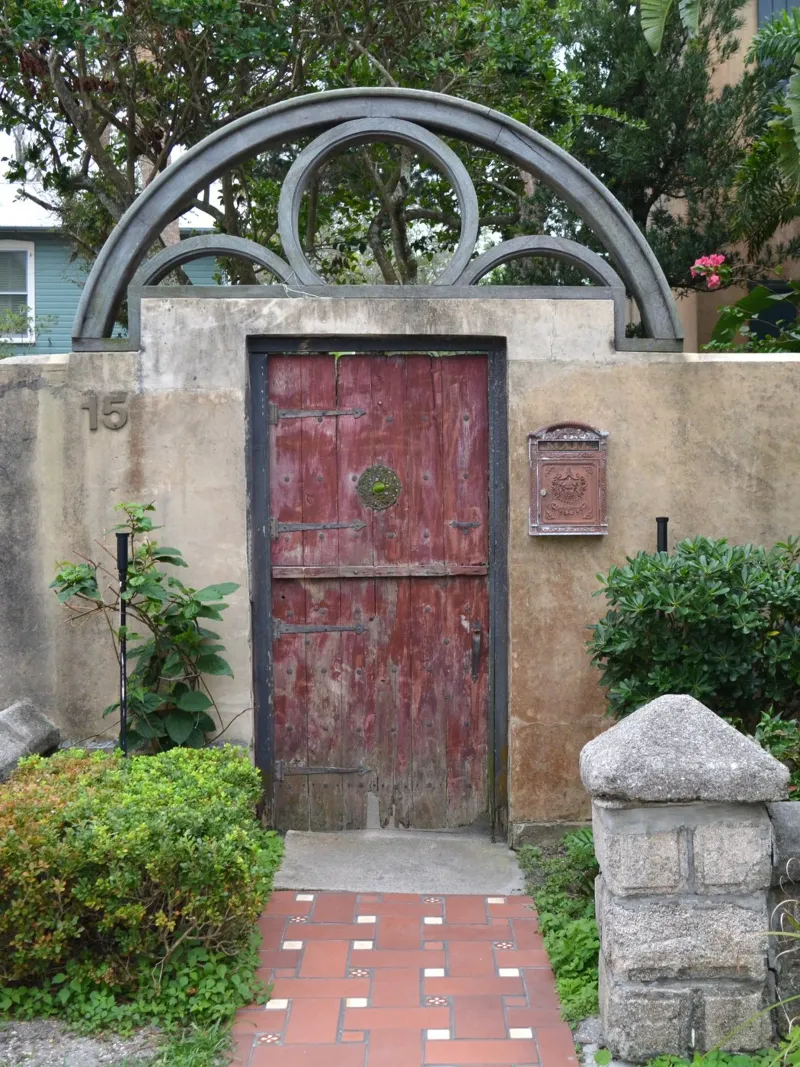 Charming Stone Wall and Wooden Door in St. Augustine acrylic glass by byrieneke