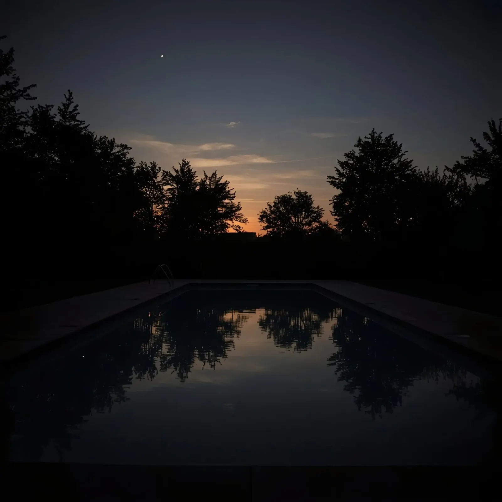 Swimming Pool at Dusk with Tree Reflections and Sunset Sky hahnemühle by DesignDoodle
