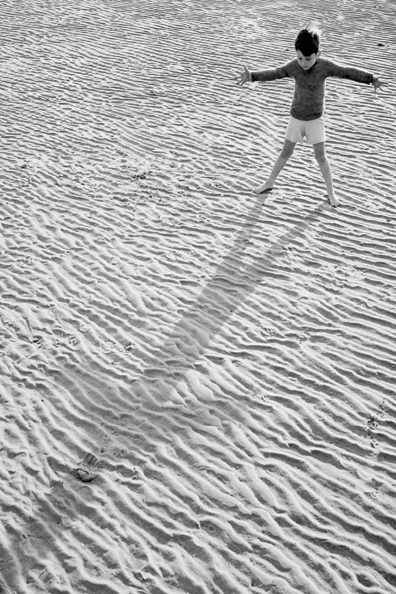 Little Boy and Shadow on Beach Black and White Old Photo canvas with Floater frame by Vibrant Vintage Prints