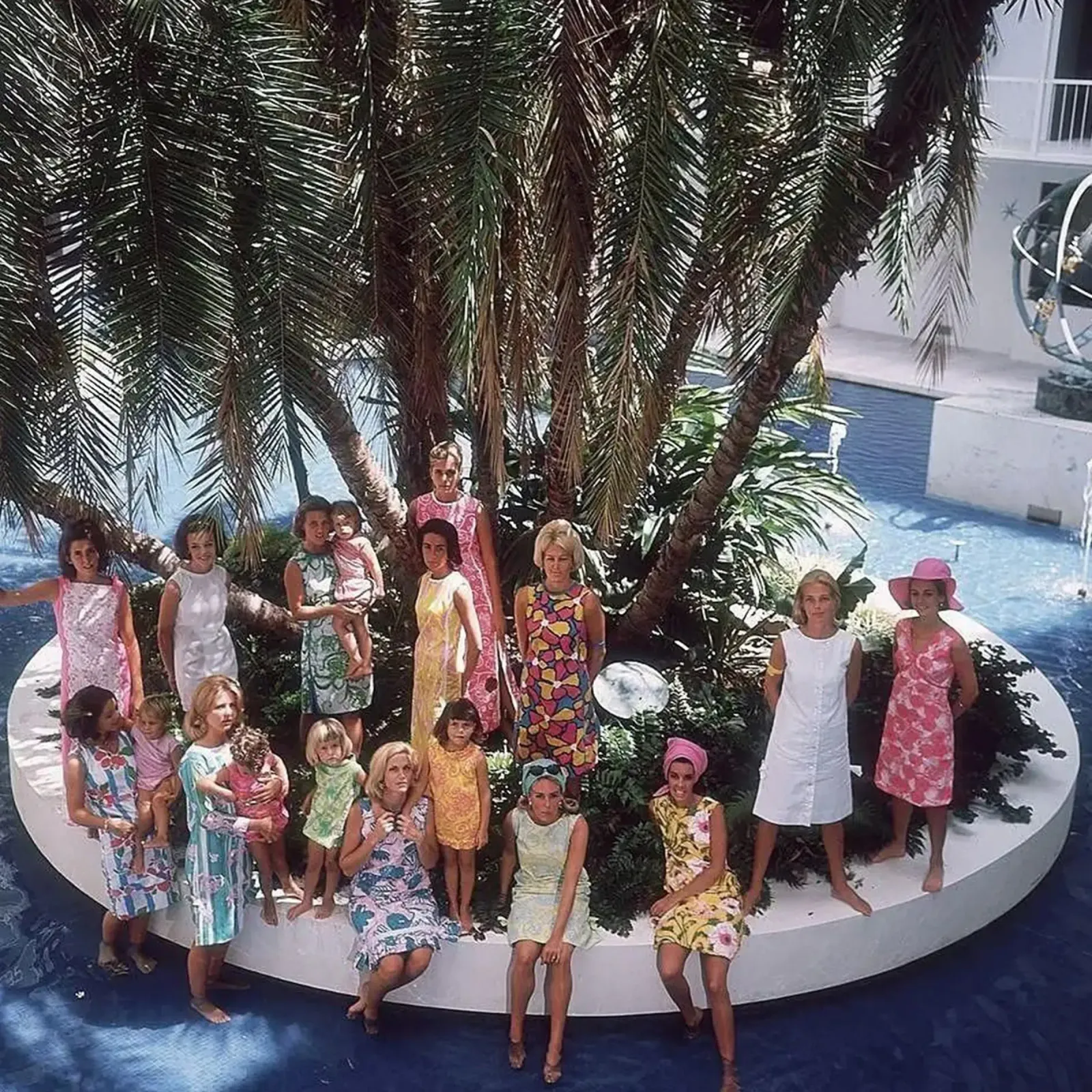 Gathering at the Pool - Slim Aarons poster with plastic frame by The Poster UK
