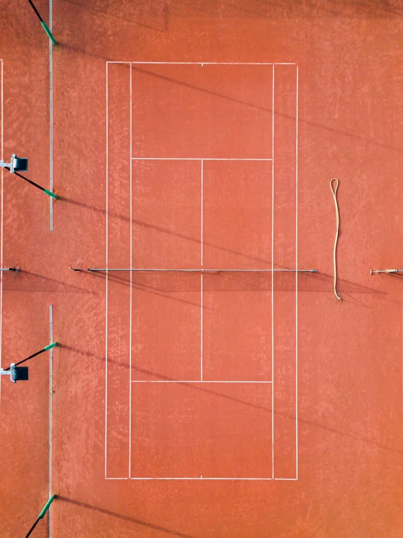Red Tennis Court at Sunrise - Colorful Photography poster by Raisa Zwart Photography