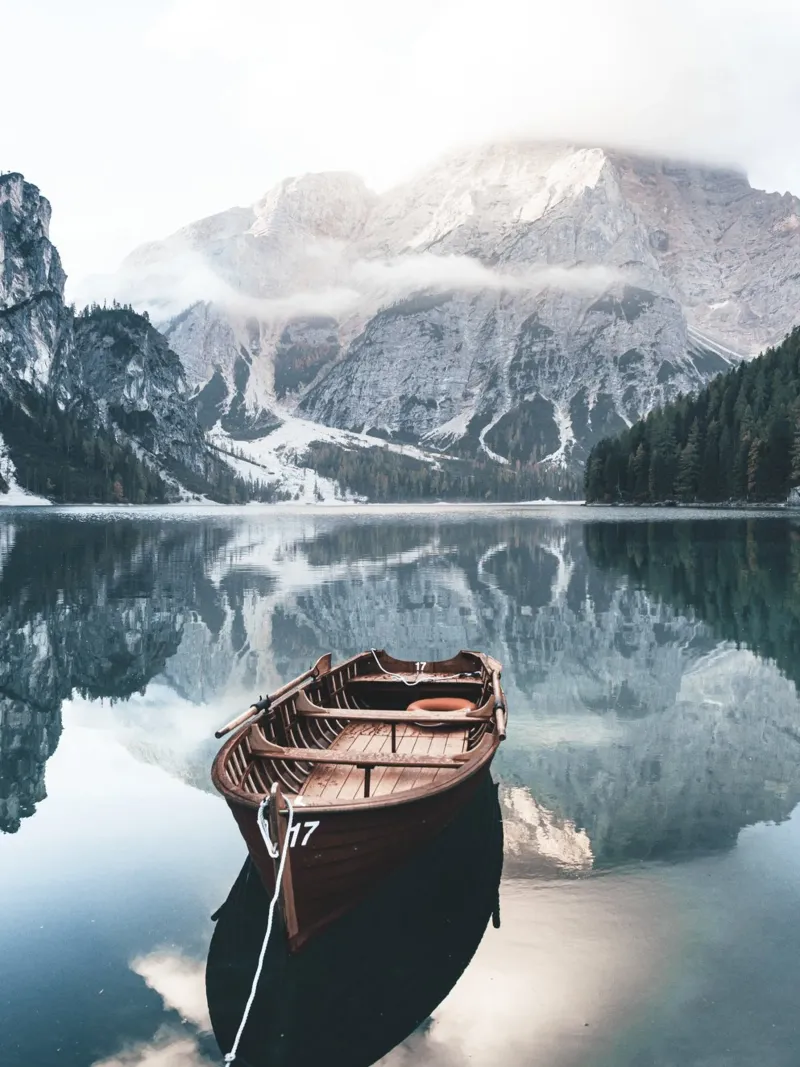 Alpine lake with boat - peaceful mountain idyll canvas by Whole©