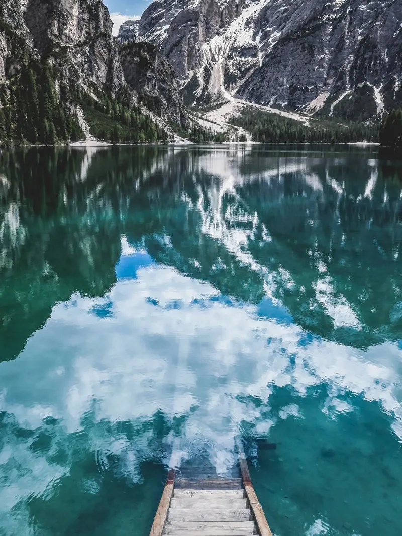 Reflecting mountain lake with jetty canvas by Whole©