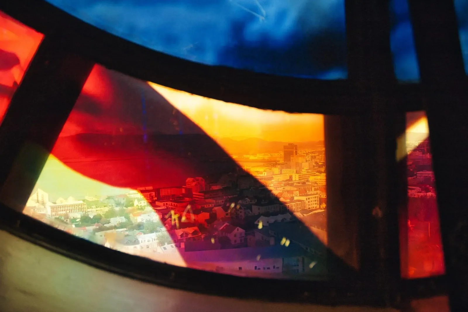 View of Reykjavik Through Hallgrímskirkja Stained Glass poster with wooden frame by Ben & Clo creations