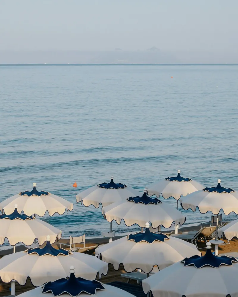 Italian Beach Umbrellas, La Dolce Vita, Summer in Europe backlit film by TheTravelClub
