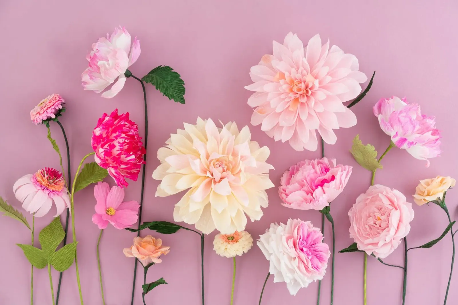 Paper flower arrangement on pink background hahnemühle by foodphotolove